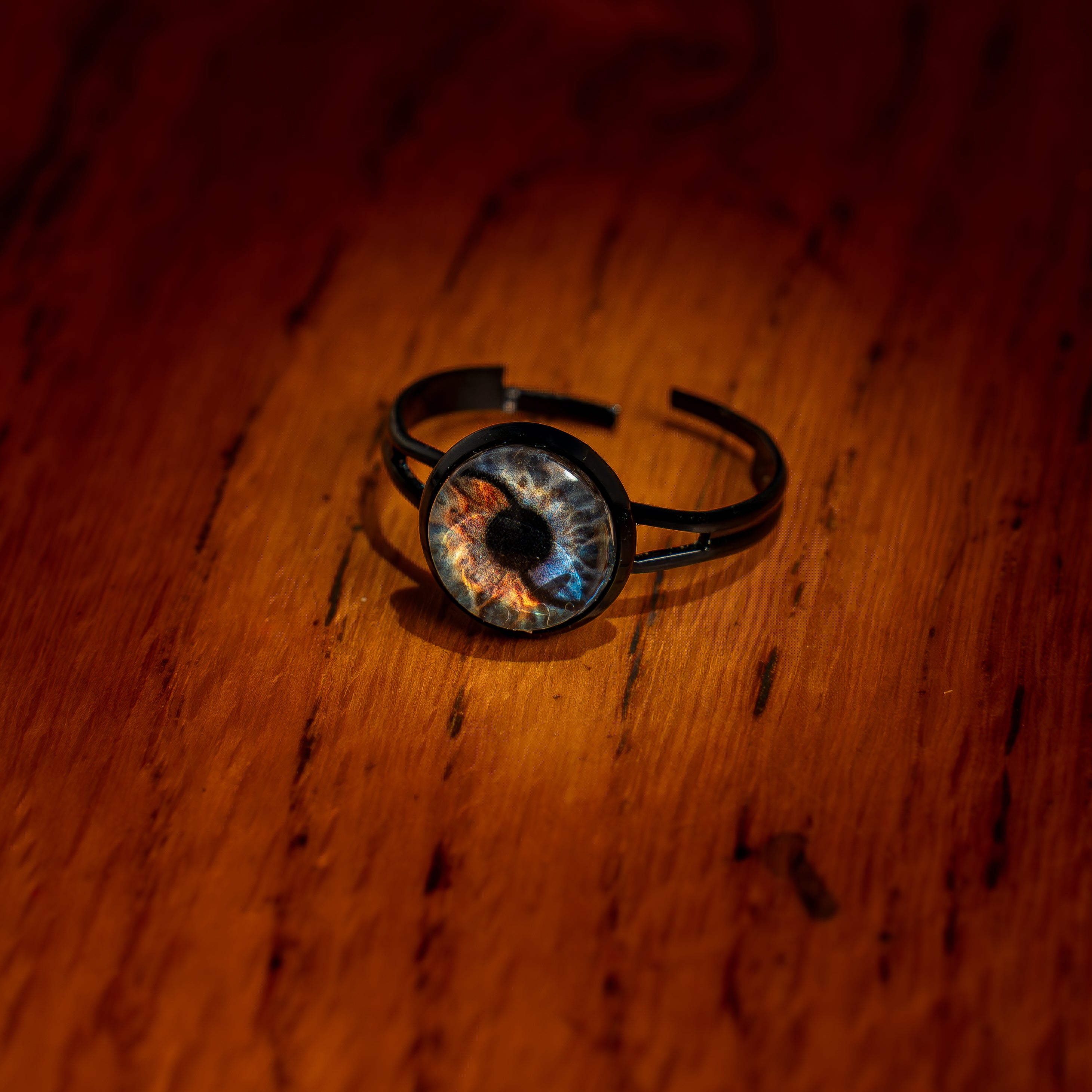Ring with a unique design on a wooden surface